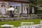 Patrons drinking coffee on the terrace of the coffee shop at the famous gardens in the West Dean estate in Hampshire in the South