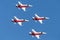 Patrouille Suisse formation display team of the Swiss Air Force flying Northrop F-5E fighter aircraft joined by the Swiss PC-7 tea