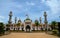 Pattani central mosque with pond minarets and Thai flag Thailand