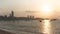 PATTAYA, THAILAND - CIRCA March 2017: Pattaya city beach at sunset boats cityscape at background