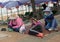 PATTAYA,THAILAND - OCTOBER 23,2018:Beach Road Three female Thai workers relax