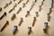 Pattern background of various screws on a wooden work table