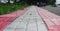 Pattern board empty tiles in front of blurred background. Perspective red and brown tile over blur footpath - we can be used for