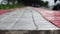 Pattern board empty tiles in front of blurred background. Perspective red and brown tile over blur footpath - we can be used for