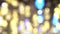 Pattern of bokeh of bright lights of a festive garland. Lens blur of bright winter party glittering lights of bulb