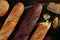 Pattern of bread. Bread assortment: baguettes, buns, loaves, dark and light bread.