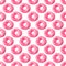 Pattern of bright pink inflatable rubber circles on a pale pink background