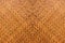 Pattern of brown woven reed mat texture background