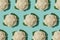 Pattern with cauliflower on turquoise background