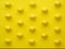 Pattern Of Chicken Eggs In Line Against Yellow Background