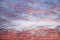 Pattern of cirrus clouds on the colored sinrise sky background