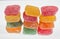 Pattern of colorful cubes jelly candies, row of sweet food texture background.