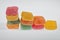 Pattern of colorful cubes jelly candies, row of sweet food texture background.