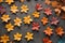 Pattern of colorful maple leaves on a black background. Top view photo idea of a group of natural leaf.