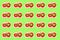 The pattern consists of a sandwich with tomatoes and greens on a light green background