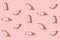 Pattern created from fresh exotic dragon fruit slices on pastel pink background. Top view