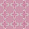 Pattern with cruciform repeating decor on a colored background.