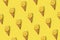 Pattern Cut Lemon with ice cream cone on bright illuminating yellow background