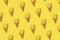 Pattern Cut Lemon with ice cream cone on bright illuminating yellow background