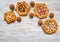 Pattern of different handmade pies on a white wooden table.