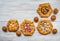 Pattern of different handmade pies on a white wooden table.