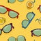 Pattern with different sunglasses and lemonade on the background of sand on the beach.