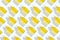Pattern of dropper bottles with white pipette and yellow liquid on white background