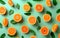 Pattern of fresh oranges over green background.