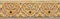 Pattern of gold flower carved on stucco design of native wall