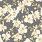 Pattern of golden orchids on a gray background