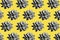 Pattern with gray Lotus flowers on yellow background,sharp strong shadows. Succulent plant. Color 2021.