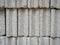 Pattern of grey concrete cement block bricks at  construction site