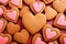 Pattern of homemade valentine cookies on red background.