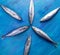 Pattern of mackerel fishes, which laid out with heads toward each other on blue background.