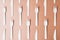 Pattern made of biodegradable eco friendly wooden cutlery on brown background