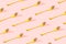 Pattern made of gold fork with nice pastel pink background. Minimal celebration party concept art