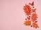 The pattern is made of orange Rowan and maple leaves, red hawthorn berries on a pink background.