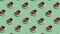 Pattern with many tea cups on saucers animated on green background
