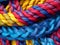 Pattern of multicolored twisted and intertwined ropes and threads.