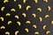 Pattern of A pile of pasta horns on black background