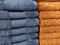 pattern of piles of blue and yellow towels on display in a shop