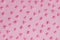 Pattern. Pink confectionery hearts on pink background, texture