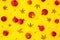 Pattern of pomegranate fuits with fall leaves isolated on bright yellow background. Flat lay