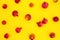 Pattern of pomegranate fuits isolated on yellow background. Food background. Flat lay