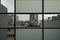 Pattern of rainy windows, part translucent, part transparent, with view o te city of Amtwerp