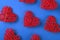 Pattern of the red wicker hearts on the cornflowerblue background.