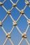 Pattern the rope mesh vertical on blue sky