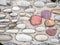 Pattern of sea stones in cement. Ground cover in the park. Background with bumps. Background of beach pebbles and concrete