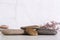 Pattern of smooth flat sea stones and dried flowers on the table