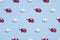 Pattern of snowflakes and red Santa gloves on pastel blue background. Minimal style. Christmas or New Year concept